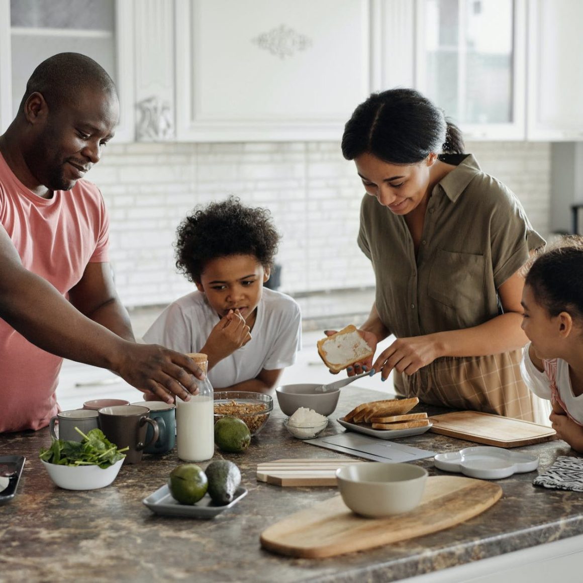 A family preparing food together in a kitchen
